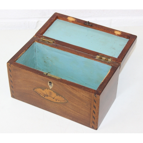 204 - A Georgian Sheraton inlaid mahogany tea caddy with inlaid shell motifs and decorative border, lackin... 