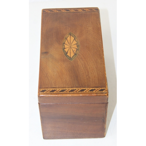 204 - A Georgian Sheraton inlaid mahogany tea caddy with inlaid shell motifs and decorative border, lackin... 