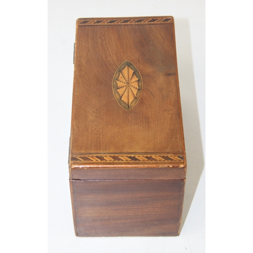 204 - A Georgian Sheraton inlaid mahogany tea caddy with inlaid shell motifs and decorative border, lackin... 