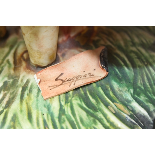 280 - Two decorative figural table lamps with shades, one by B. Merti, the other Capodimonte and a Capodim... 