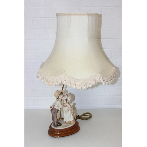 280 - Two decorative figural table lamps with shades, one by B. Merti, the other Capodimonte and a Capodim... 