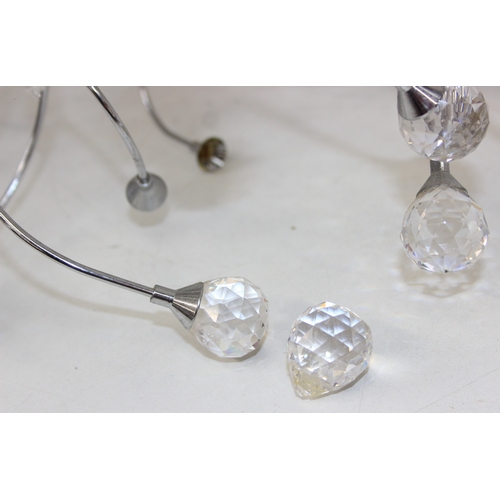 316 - A retro style pendant light with chrome twisted body mounted with crystals, 60cm in diameter