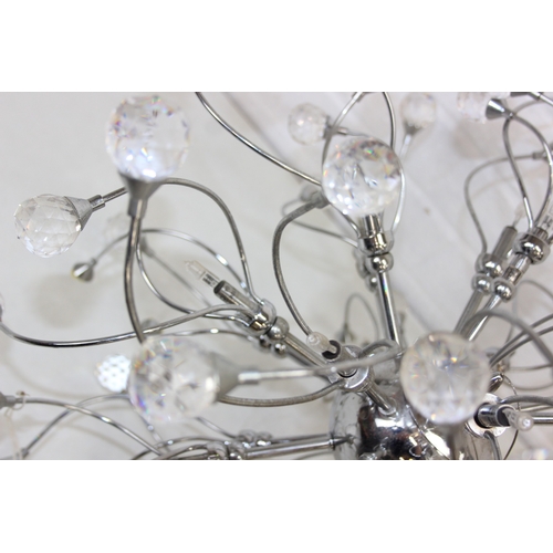 316 - A retro style pendant light with chrome twisted body mounted with crystals, 60cm in diameter