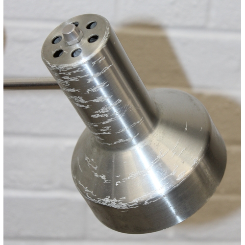 317 - A retro floor standing pole lamp with aluminium shades, 144cm tall