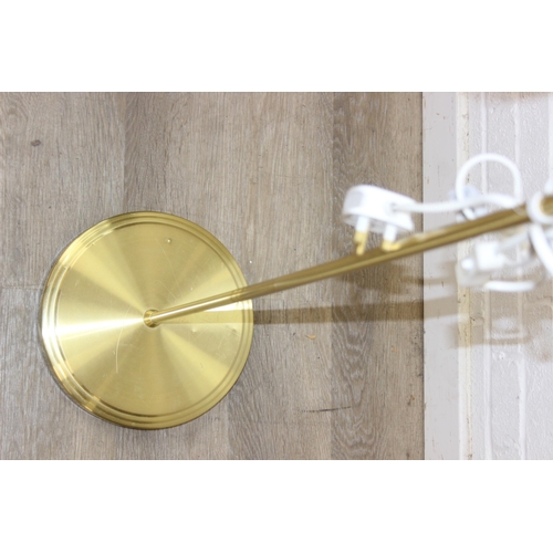 322 - A vintage brass swan neck floor standard lamp with white glass shade, 140cm tall