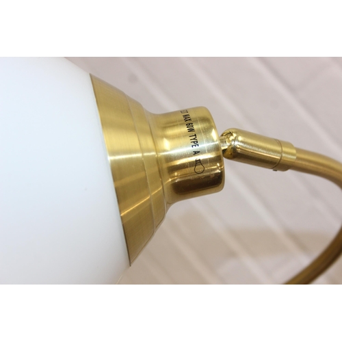 322 - A vintage brass swan neck floor standard lamp with white glass shade, 140cm tall