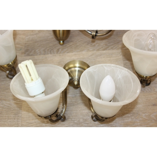 325 - A qty of matching light fittings, all with brushed copper effect bodies and marble effect glass shad... 