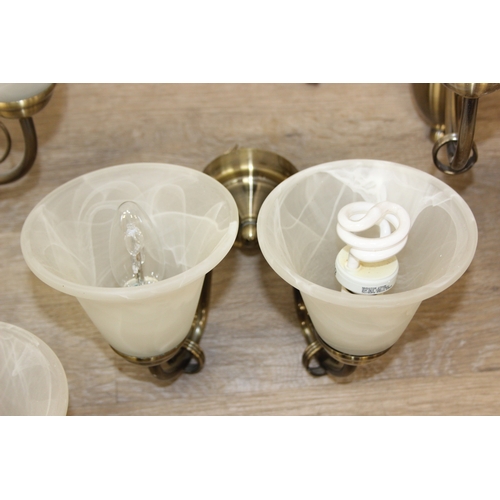 325 - A qty of matching light fittings, all with brushed copper effect bodies and marble effect glass shad... 