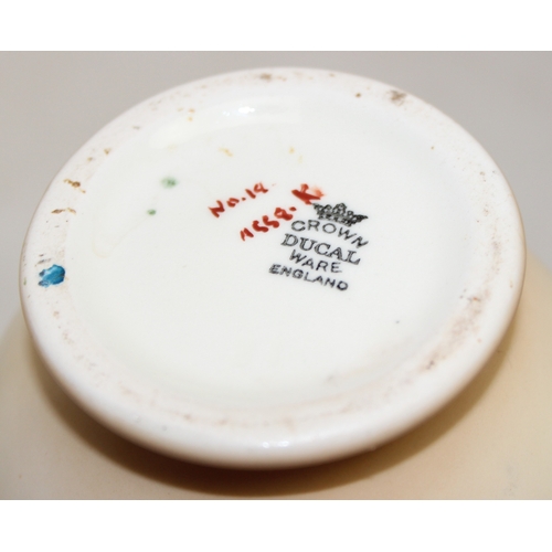 1580 - A pair of Crown Ducal vases decorated with Peacocks, each 25cm tall