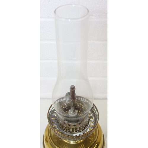 276 - Two brass and glass lamps, one an oil lamp and the other a gas lamp, one with chimney but both with ... 
