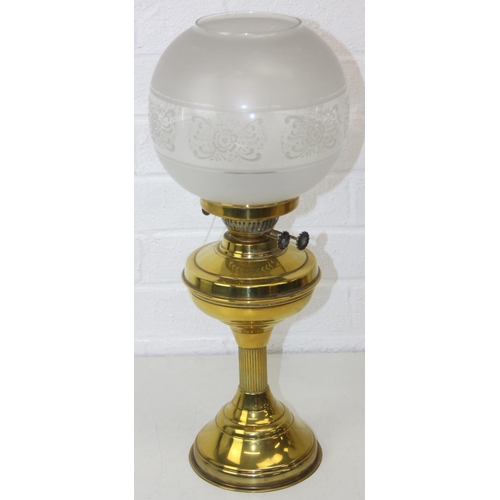 276 - Two brass and glass lamps, one an oil lamp and the other a gas lamp, one with chimney but both with ... 