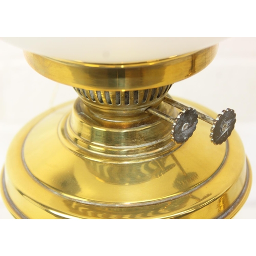 276 - Two brass and glass lamps, one an oil lamp and the other a gas lamp, one with chimney but both with ... 