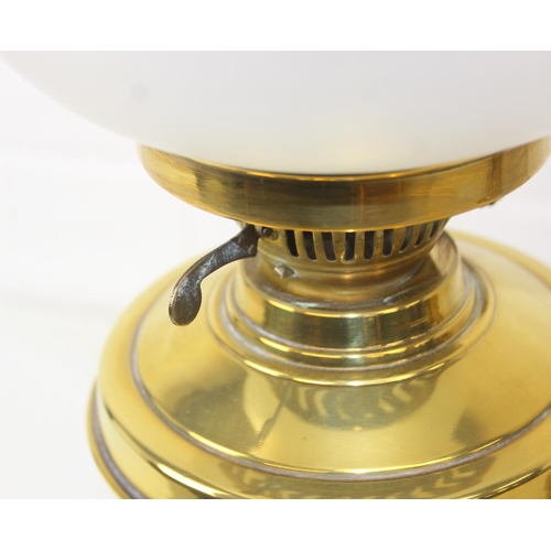 276 - Two brass and glass lamps, one an oil lamp and the other a gas lamp, one with chimney but both with ... 