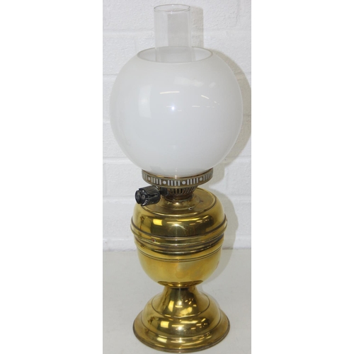 276 - Two brass and glass lamps, one an oil lamp and the other a gas lamp, one with chimney but both with ... 