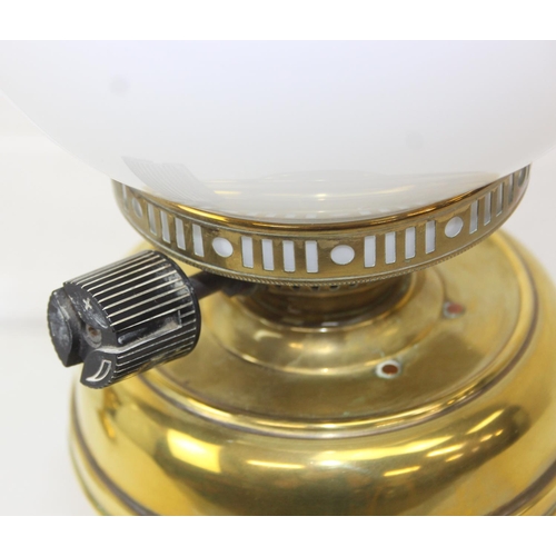 276 - Two brass and glass lamps, one an oil lamp and the other a gas lamp, one with chimney but both with ... 