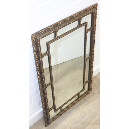 424 - A vintage decorative gilt framed wall mirror, marked 