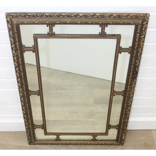 424 - A vintage decorative gilt framed wall mirror, marked 