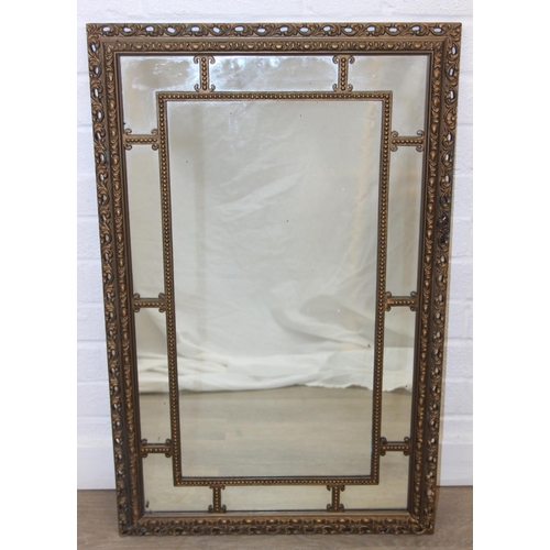 424 - A vintage decorative gilt framed wall mirror, marked 