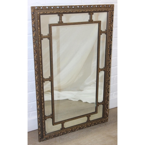 424 - A vintage decorative gilt framed wall mirror, marked 