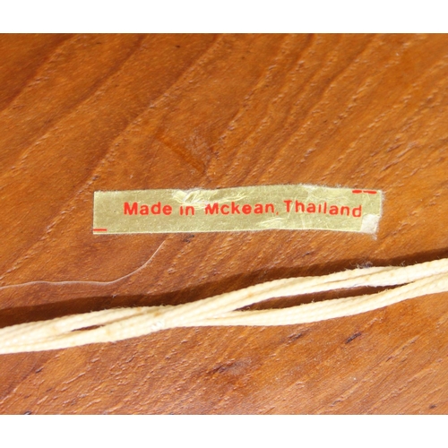 442 - An Asian carved relief hardwood panel depicting elephants and jungle, marked made in Thailand, 63cm ... 