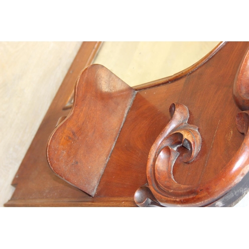 445B - Antique over mantle mirror in mahogany frame with carved details and two display shelves, 165cm x 99... 