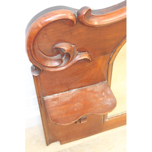 445B - Antique over mantle mirror in mahogany frame with carved details and two display shelves, 165cm x 99... 