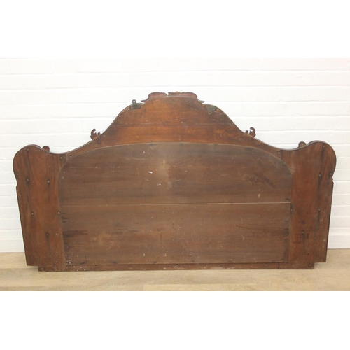 445B - Antique over mantle mirror in mahogany frame with carved details and two display shelves, 165cm x 99... 