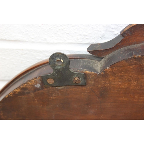 445B - Antique over mantle mirror in mahogany frame with carved details and two display shelves, 165cm x 99... 