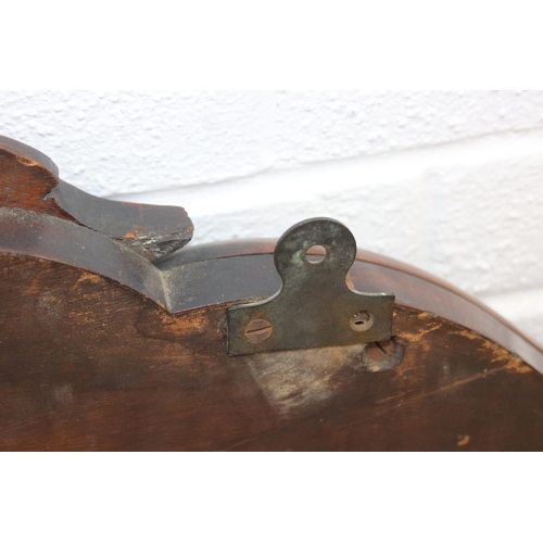 445B - Antique over mantle mirror in mahogany frame with carved details and two display shelves, 165cm x 99... 