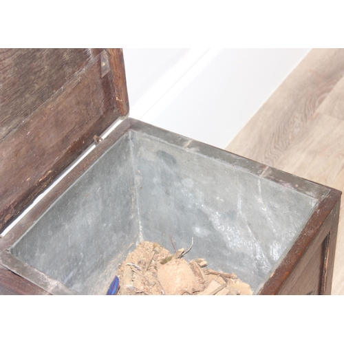 108 - An antique oak cellarette or coal bucket with metal lining, seemingly made from parts of an 18th cen... 