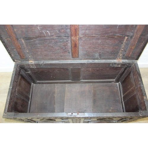 102 - An antique carved oak coffer, likely 18th century with carved details, unusual small size, 94cm x 46... 