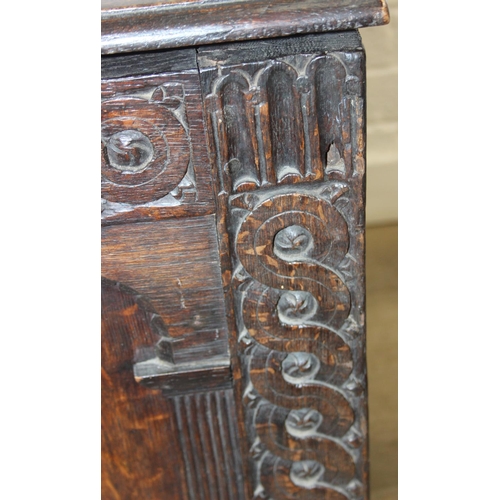 102 - An antique carved oak coffer, likely 18th century with carved details, unusual small size, 94cm x 46... 