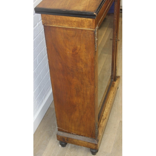 101 - A Victorian walnut and marquetry inlaid pier cabinet or glazed bookcase with gilt metal mounts, two ... 