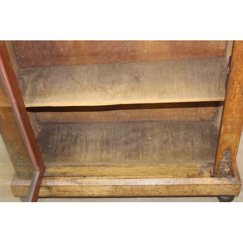 101 - A Victorian walnut and marquetry inlaid pier cabinet or glazed bookcase with gilt metal mounts, two ... 