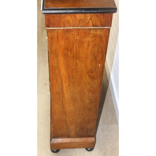 100 - A Victorian walnut and marquetry inlaid pier cabinet or glazed bookcase with gilt metal mounts, two ... 
