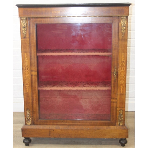 100 - A Victorian walnut and marquetry inlaid pier cabinet or glazed bookcase with gilt metal mounts, two ... 