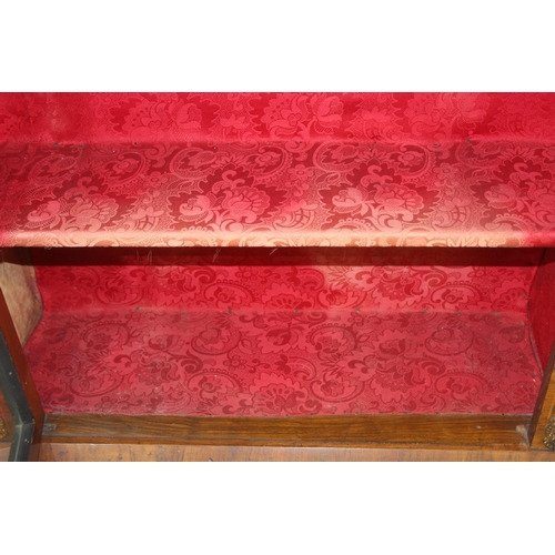 100 - A Victorian walnut and marquetry inlaid pier cabinet or glazed bookcase with gilt metal mounts, two ... 