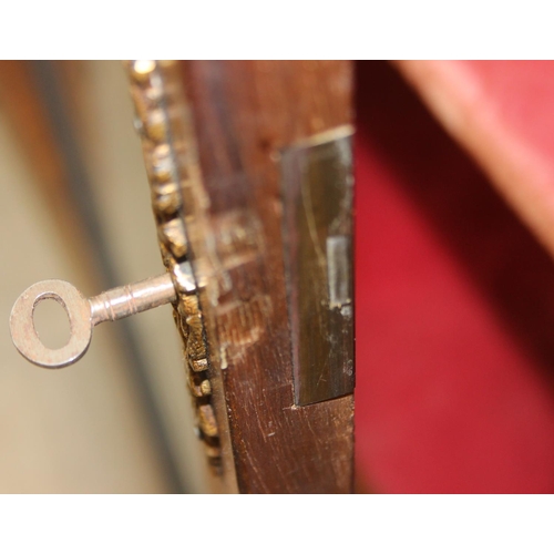 100 - A Victorian walnut and marquetry inlaid pier cabinet or glazed bookcase with gilt metal mounts, two ... 