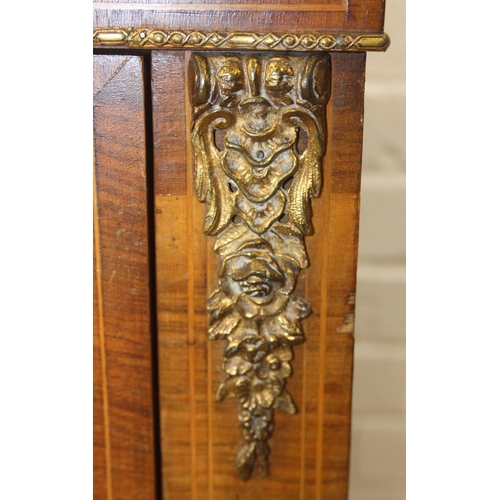 100 - A Victorian walnut and marquetry inlaid pier cabinet or glazed bookcase with gilt metal mounts, two ... 