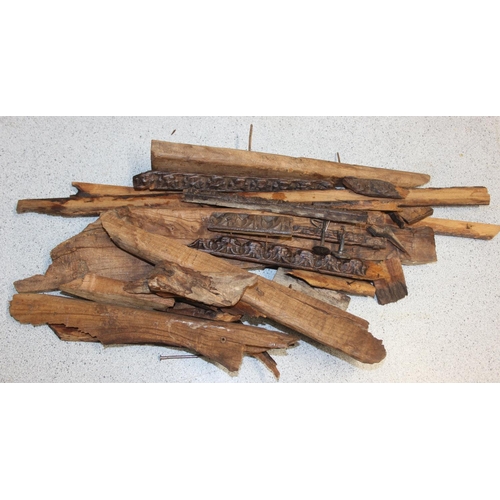 75 - A pair of antique hardwood doors with brass roundels, believed to be Indonesian and made from teak, ... 