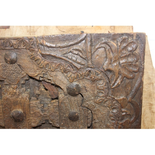 75 - A pair of antique hardwood doors with brass roundels, believed to be Indonesian and made from teak, ... 