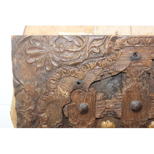 75 - A pair of antique hardwood doors with brass roundels, believed to be Indonesian and made from teak, ... 