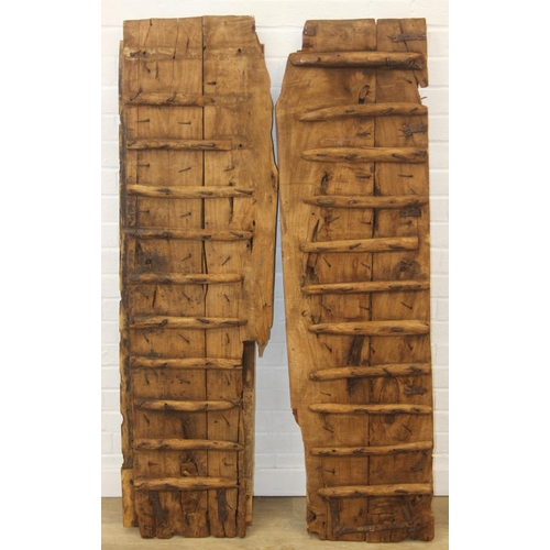 75 - A pair of antique hardwood doors with brass roundels, believed to be Indonesian and made from teak, ... 