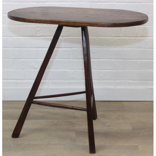 45 - An unusual oak topped table with three legged base, possibly a cricket table, 71cm x 42cm x 67cm