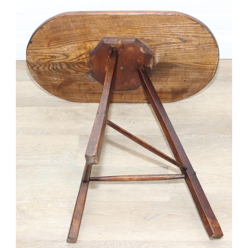 45 - An unusual oak topped table with three legged base, possibly a cricket table, 71cm x 42cm x 67cm