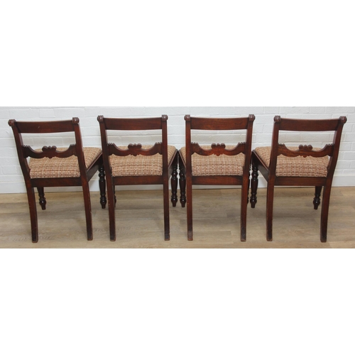 83 - A set of four Regency period mahogany dining chairs with carved back and turned legs, brown palette ... 