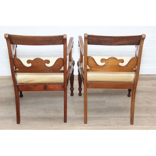 90 - A pair of antique carver armchairs with carved backs and turned legs, decorative scroll arms, gold c... 