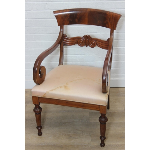 65 - An antique Regency style carved armchair with decorative scroll arms, carved back and turned and car... 