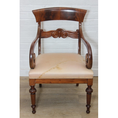 65 - An antique Regency style carved armchair with decorative scroll arms, carved back and turned and car... 