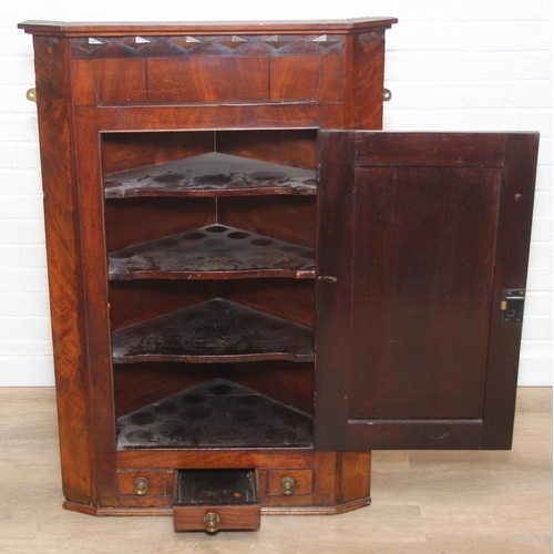 69 - A Georgian mahogany corner cupboard with a central drawer to bottom frieze flanked by two faux drawe... 